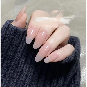 Handmade almond-shaped nude pink jelly gradient press-on nails for a minimalist look