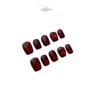 Handmade wine red cat-eye press-on nails with luxury ruby gemstones and velvet finish