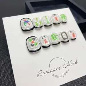 Handmade mahjong press-on nails set with 3D embossed designs and unique character patterns