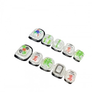 3D Mahjong themed press-on nails with classic tile patterns on a white background