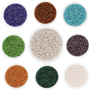 Detailed top view of 9 colors glass seed beads arranged in round transparent trays for DIY
