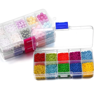 DIY jewelry kit with colorful beads and faux pearls in clear multi-grid storage cases