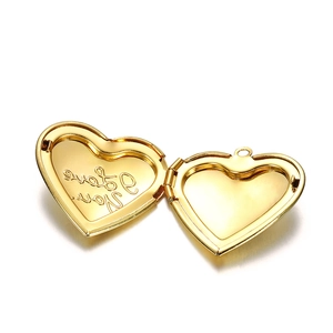 Detailed macro view of heart locket interior with I Love You engraving and photo slot