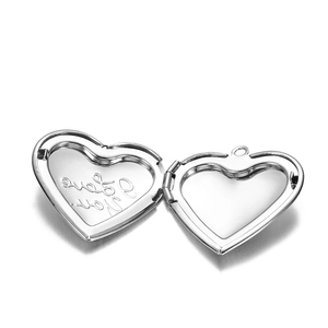 Detail of heart locket featuring 'I Love You' engraving and photo storage space