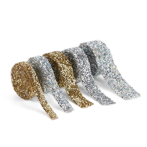 Rolls of shiny gold and iridescent silver rhinestone ribbon for DIY wedding decor