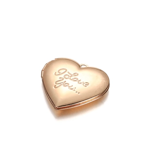 Polished rose gold heart-shaped locket pendant with I Love You engraving on white background
