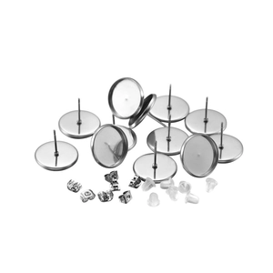 Macro view of stainless steel earring stud trays with metal and silicone butterfly backings
