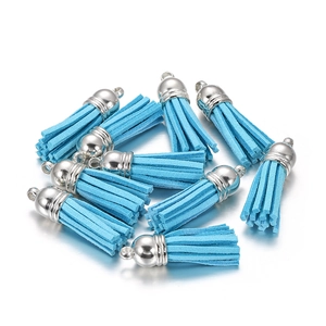 Close-up of sky blue faux suede tassel pendants with polished silver metal caps