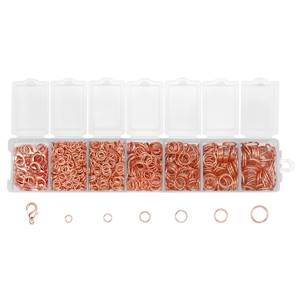 Detail view of rose gold lobster clasps and open jump rings in a 7-grid storage box