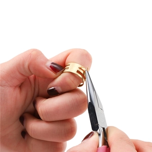 Pink flat-nose pliers and gold jump ring opener for DIY jewelry making and assembly