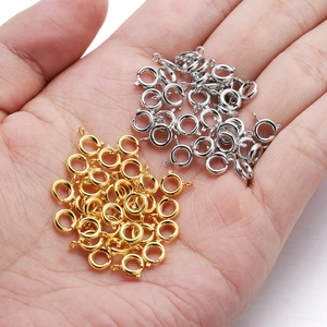 Macro detail of 6mm gold and silver spring ring clasps for DIY jewelry making