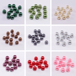 Macro detail of multi-colored round ABS faux pearl beads for DIY jewelry making
