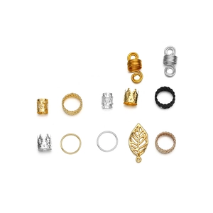 Assorted DIY dreadlock hair accessories in gold and silver including rings and leaf charms