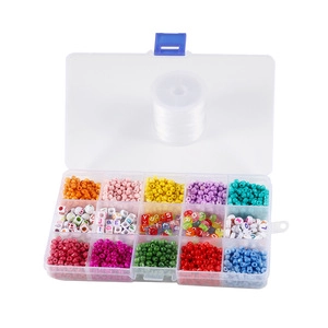 Macro view of a 15-grid storage box with colorful beads and crystal elastic string
