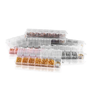Macro view of multi-compartment organizers with sorted assorted color jump rings