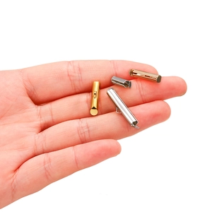 Close-up of gold and silver slide end tubes for multi-strand jewelry making