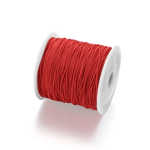 Detailed view of durable red elastic beading cord neatly wound on a white plastic spool