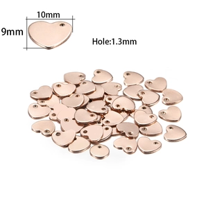 Macro detail of rose gold heart pendants showing 10mm dimensions and 1.3mm hole size