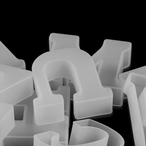 Detailed macro shot of translucent silicone alphabet molds for DIY epoxy resin crafts