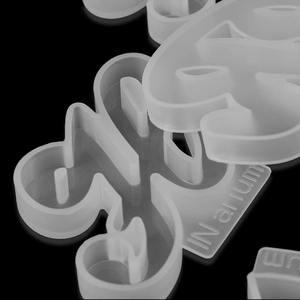 Macro detail of translucent silicone alphabet mold for DIY resin jewelry and pendant making