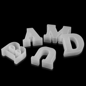 Detailed macro view of white translucent silicone alphabet letter molds for DIY resin crafts
