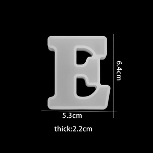 Macro shot of letter E silicone resin mold showing 6.4cm height and 2.2cm thickness