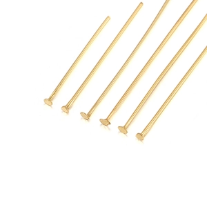 Macro shot of gold-plated stainless steel flat head pins for DIY jewelry making