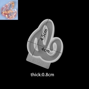 Detail view of lowercase script letter silicone mold with resin sample and size specs