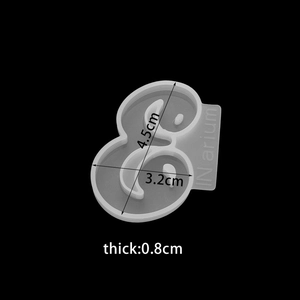 Detailed view of translucent silicone ampersand mold with size markers 4.5x3.2x0.8cm