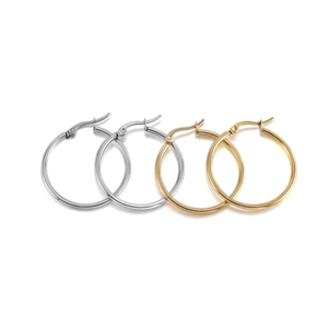 Golden and silver stainless steel hoop earrings with clasp closure on white background