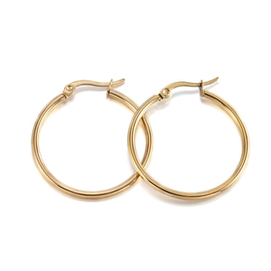 Detailed view of polished gold plated stainless steel hoop earrings with fish hook clasp