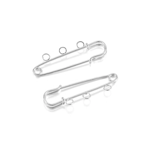 Macro detail of silver safety pin brooch findings with three loops for DIY jewelry making