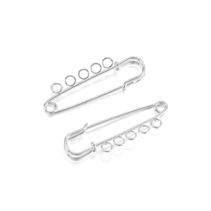 Macro detail of silver tone safety pin brooch base with five loops for DIY jewelry