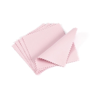 Close-up of pink microfiber jewelry cleaning cloths with decorative serrated edges
