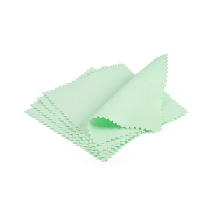 Macro detail of mint green microfiber jewelry cleaning cloths with serrated edges