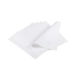 Macro shot of layered white microfiber cleaning cloths with zigzag edges for jewelry