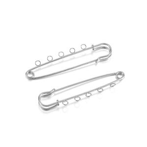 Macro view of silver stainless steel safety pins with five hanging loops for DIY jewelry