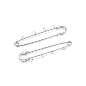 Macro detail of silver safety pins with multiple loops for DIY jewelry brooches