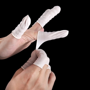 Detail showing the high elasticity and flexibility of white latex finger cots on a hand