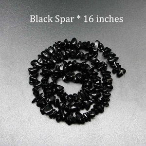 Detailed view of 16-inch black spar irregular natural stone beads for DIY jewelry making