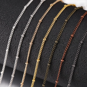 Close-up of assorted satellite bead chains for DIY jewelry making in various finishes