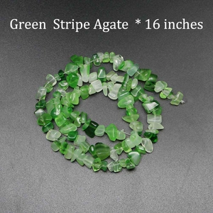 Macro shot of 16-inch natural green stripe agate chip beads for DIY jewelry making