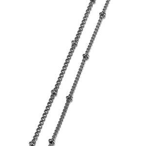 Detailed macro view of gunmetal beaded metal chain links for DIY jewelry making