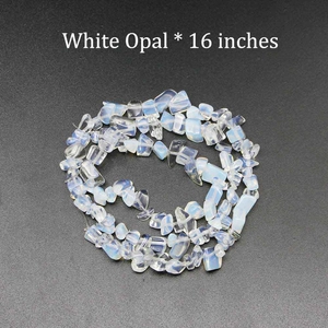 Macro detail of 16-inch strand natural irregular white opal stone chips for DIY jewelry