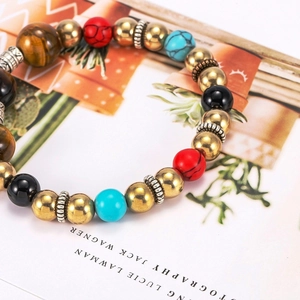 Bohemian mixed gemstone bracelet with brass spacer beads and vintage metal accents