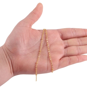 Minimalist gold beaded curb chain for DIY body jewelry and necklaces shown on hand