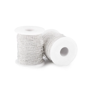 Detailed view of silver DIY jewelry making chains wound on two white plastic spools