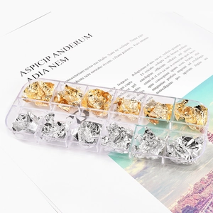 Detailed macro view of 12-slot storage box with gold and silver metallic foil flakes