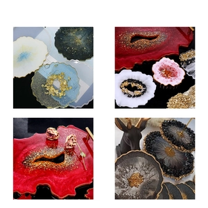 Macro detail of resin geode coasters with gold foil edges and luxury metallic handles