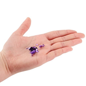 Close-up of shiny purple metallic foil flakes for DIY resin art and nail decoration